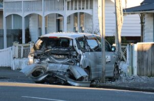 A parked van was hit by a ute and shunted 40m across Lincoln Rd, Masterton, crashing into a powerpole. PHOTO/HAYLEY GASTMEIER