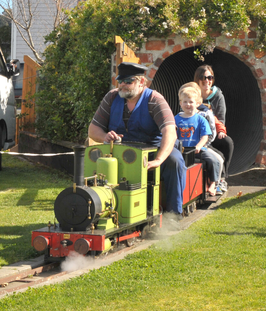 Mini Fell Train driver Peter Gibbs emerges from the tunnel at Featherston’s carnival on Saturday. PHOTO/CHRIS KILFORD