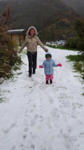 Featherston mother Karen Shaw and her 3-year-old daughter Rosalind enjoying the snowfall at the Rimutaka Hill Summit. PHOTO/SUPPLIED
