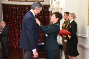 Tom Hullena becoming a member of the New Zealand Order of Merit for services to education. He was given the award by new Governor-General Dame Patsy Reddy, of Greytown. PHOTO/GOVERNMENT HOUSE