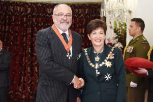 Sir Ron Young at an investiture ceremony at Government House, where he received the insignia of a Knight Companion of the New Zealand Order of Merit for services to the judiciary. Governor-General Dame Patsy Reddy presented it. PHOTO/GOVERNMENT HOUSE