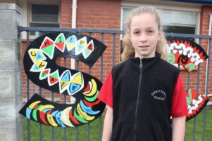 Esther Williams, 9, helped design and paint the ‘S’. PHOTO/EMILY NORMAN