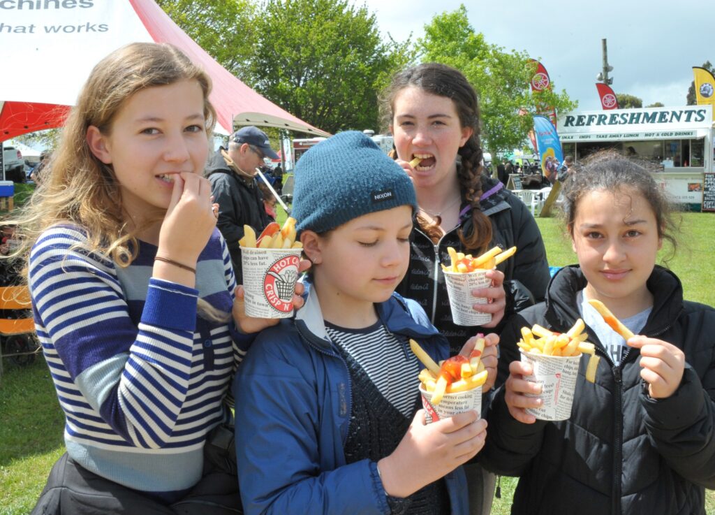 Sadie Galloway, Esther Galloway, Kyla Greenfield and Ronza Lazar, all of Wellington, tuck in to their snacks. PHOTO/CHRIS KILFORD