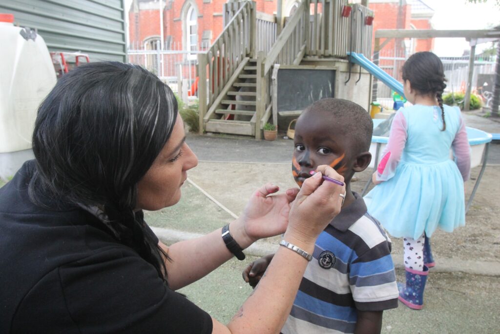 Nathanael Madembo, 3, gets his face painted in Halloween style. PHOTO/BECKIE WILSON