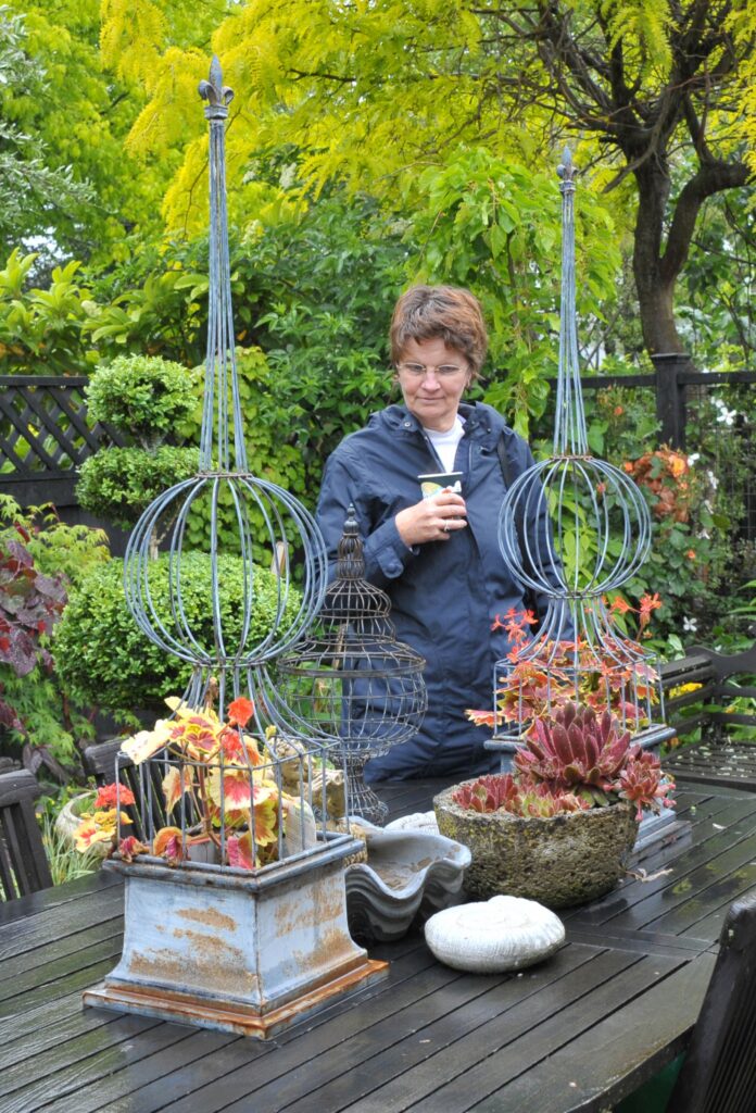 Wairarapa Garden Tour, Greytown, Saturday, Jacquie Brookman (Featherston) admires the table display. PHOTO/CHRIS KILFORD