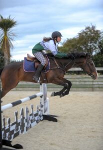 Solway College student Anna Rossiter-Stead rides Highbridge Zephyr at the equestrian academy. PHOTO/DAVE LINTOTT