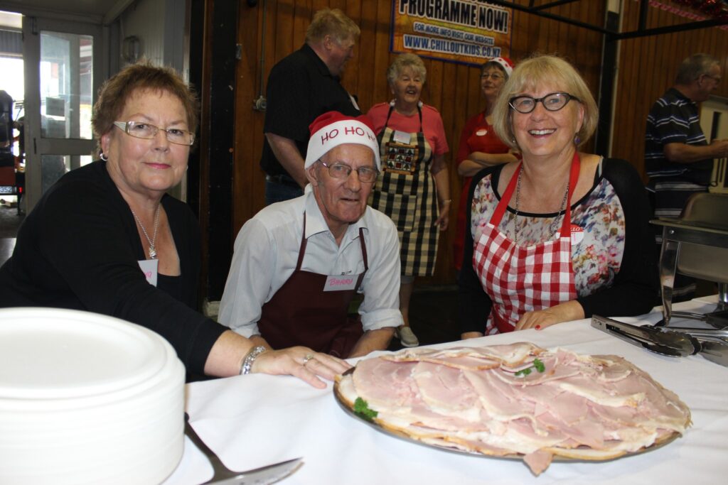 From left, Barbara Lambert and Barry Scobie from Masterton, and Gail MacKenzie of Featherston help dish out the food. PHOTO/EMILY NORMAN