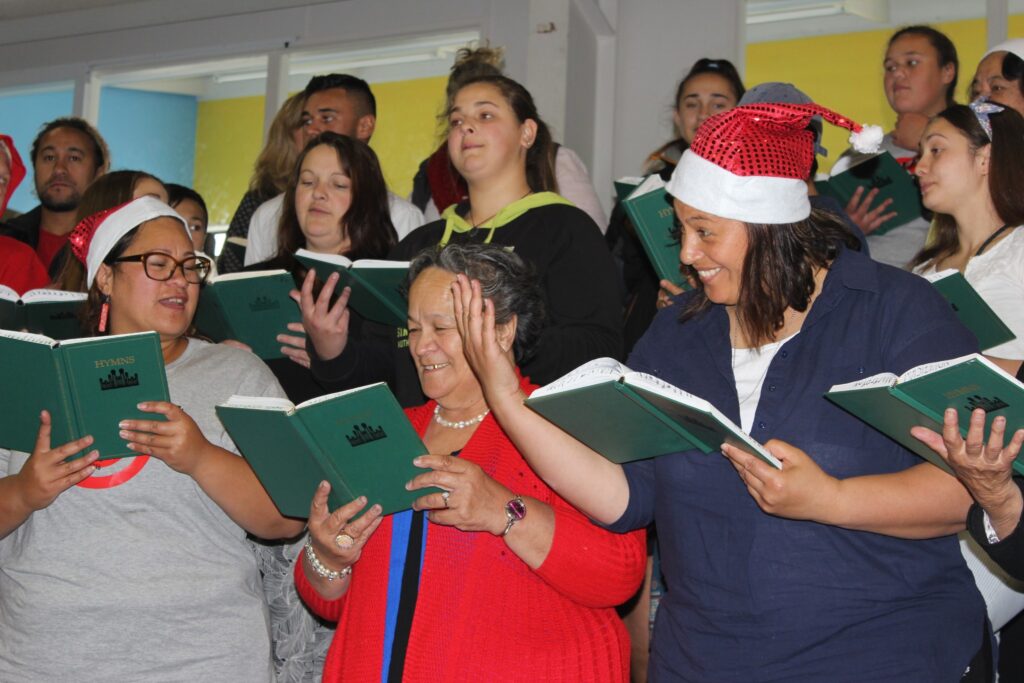 Members of The Church of Jesus Christ of Latter Day Saints and friends provide musical entertainment for guests. PHOTO/EMILY NORMAN