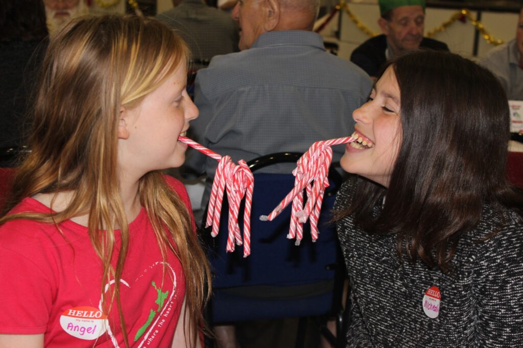 Sisters Angel and Michaela Norman show off their candy cane haul. PHOTO/EMILY NORMAN