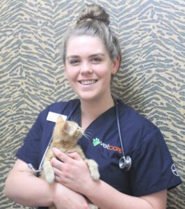 Vet technician Danielle Bolton holds Mikey, who is available for adoption. PHOTO/CHELSEA BOYLE