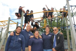 The Ka Rewa crew, (from left) Whatahoro Fox, Nathan Riwai-Couch (aka Chopper), Kendyl Walker, AJ Aporo and kaumatua Ben Fox, with some of the Featherston School kids who will be doing the course. PHOTO/HAYLEY GASTMEIER