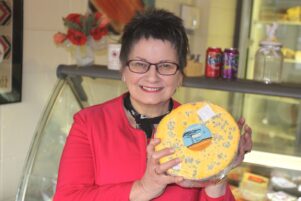 Janet King in 2014 holding the Kingsmeade cheeses that was a part of a cheeseboard sampled by the Duke and Duchess of Cambridge at a Premier House dinner. PHOTO/FILE