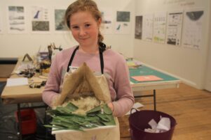 Guinevere Eatwell holding the whare model she made on the first day of the holiday programme. PHOTO/CHELSEA BOYLE
