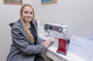Emma Schdroski can’t wait to use her new sewing machine she won in August. PHOTO/EMILY NORMAN