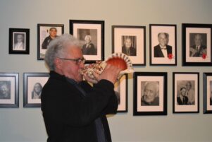 Curator Haami Te Whaiti blows a conch to call everyone together. PHOTO/CHELSEA BOYLE