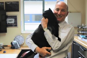 Michael Mercer with his cat Pinot Noir. PHOTO/CHELSEA BOYLE