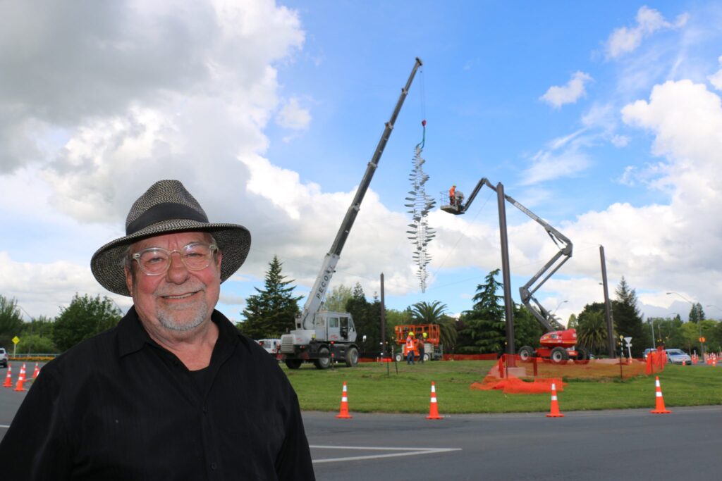 Mr Dawson, standing chuffed in front of his public artwork. PHOTO/HAYLEY GASTMEIER