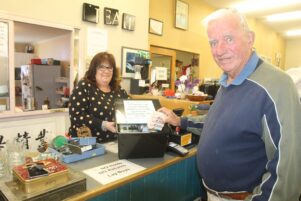 Wairarapa resource centre Trudie Jones accepts a donation of soaps from Denis O’Leary. PHOTO/EMILY NORMAN